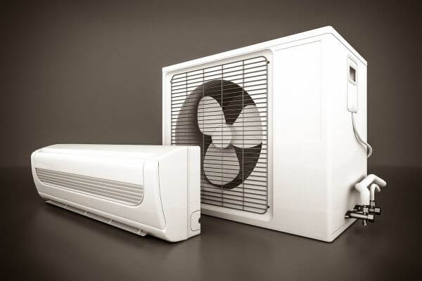 an air conditioner next to a compressor